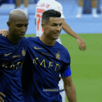 Two Men On Field One Blue Kafd Shirt GIF
