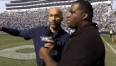Two Men On Football Field With BTN Mic GIF