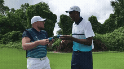 Two Men On Golf Course Shirt Says Lacoste GIF