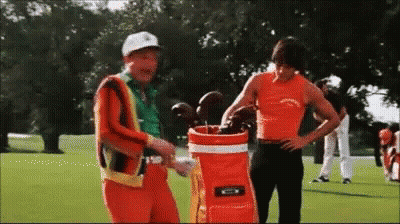 Two Men On Golf Course With Golf Bag GIF