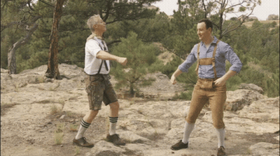 Two Men On Rocky Hillside One In Brown Pants GIF