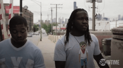 Two Men On Sidewalk With Showtime GIF