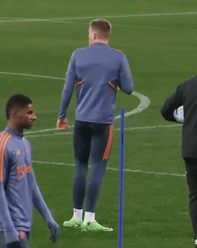 Two Men On Soccer Field One In Blue Adidas GIF