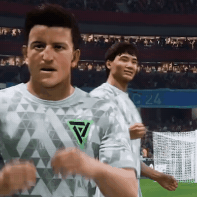 Two Men On Soccer Field One With Green Triangle Shirt GIF