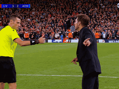 Two Men On Soccer Field With Scoreboard Saying Liv 3 2 Atm GIF