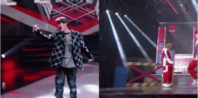 Two Men On Stage One With Microphone GIF