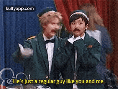 Two Men On Stage Talking About Regular Guy GIF