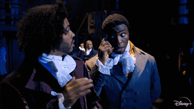 Two Men On Stage With Disney+ Logo GIF