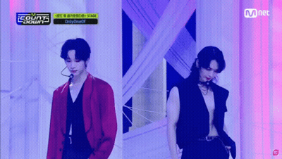 Two Men On Stage With Sign Saying Counts Down GIF