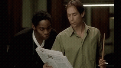 Two Men One Holding Pool Cue In Pool Room GIF