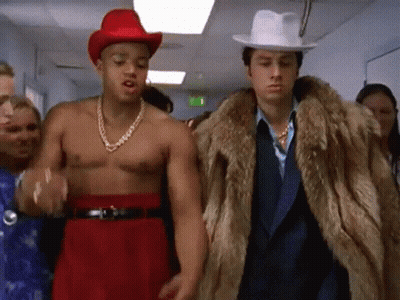 Two Men, One In Fur Coat And Hat GIF