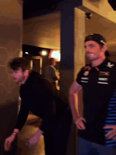 Two Men, One In Red Bull Shirt GIF
