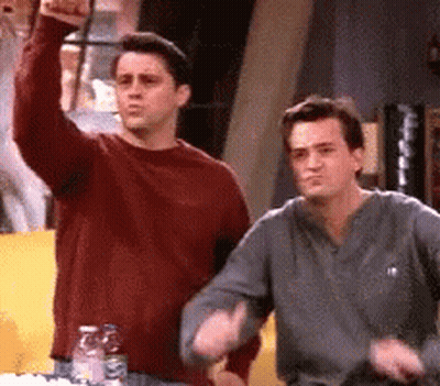 Two Men One Raising Fist GIF