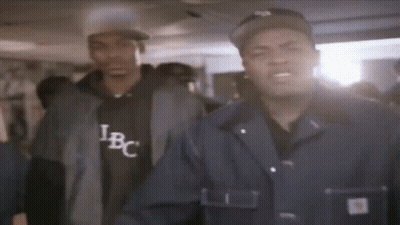 Two Men One Wearing IBC Shirt GIF