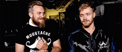 Two Men One Wearing Moustache Shirt GIF