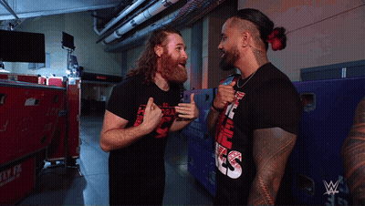 Two Men One Wearing Smack Down Shirt GIF