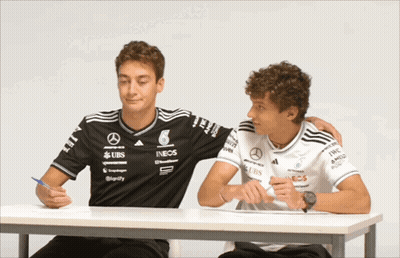 Two Men One Wearing UBS Shirt GIF