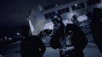 Two Men, One Wearing We Shirt GIF