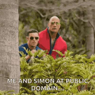 Two Men Peeking Out From Behind A Bush With A Caption That Says Me And Simon At Public Domain GIF