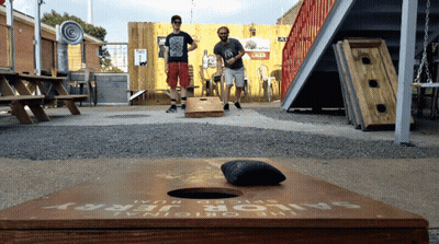 Two Men Playing A Game Of Sailor Jerry GIF
