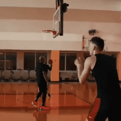 Two Men Playing Basketball One In Nike Shorts GIF