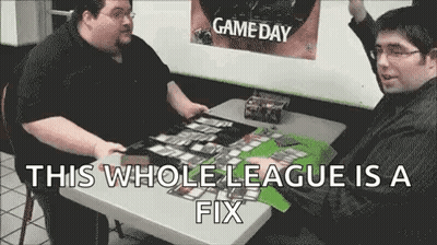 Two Men Playing Cards At Table GIF