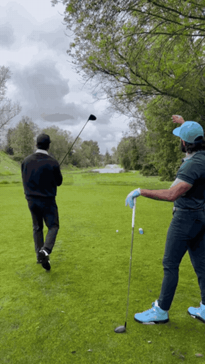 Two Men Playing Golf GIF