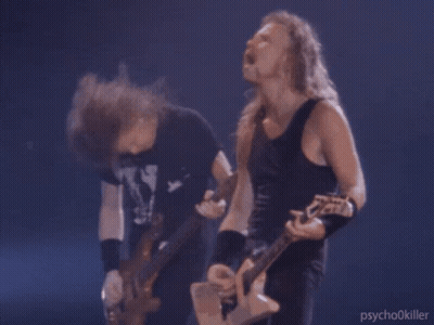 Two Men Playing Guitars, One In Psychokiller Tank Top GIF