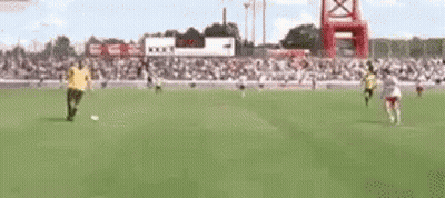 Two Men Playing Soccer GIF
