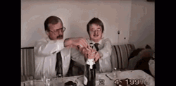 Two Men Popping Champagne