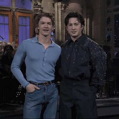 Two Men Posing Blue Shirt And Black Shirt GIF