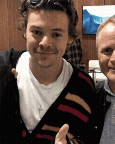 Two Men Posing For Picture One With Cross Necklace GIF