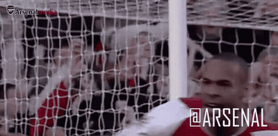 Two Men Posing, One In Nike Shirt GIF