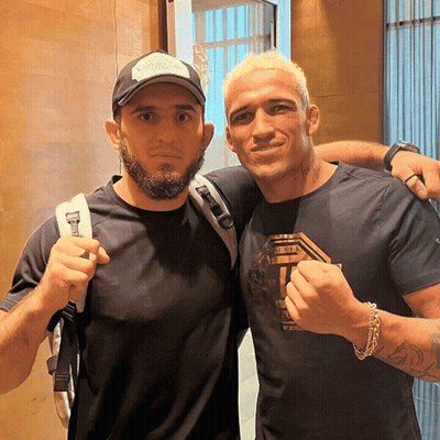Two Men Posing One in UFC Shirt