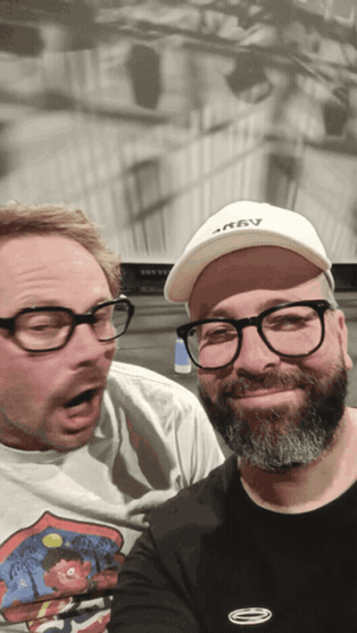 Two Men Posing One Wearing Krav Hat GIF