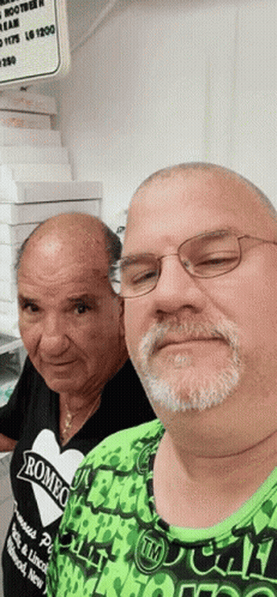 Two Men Posing One Wearing Romeo Shirt GIF