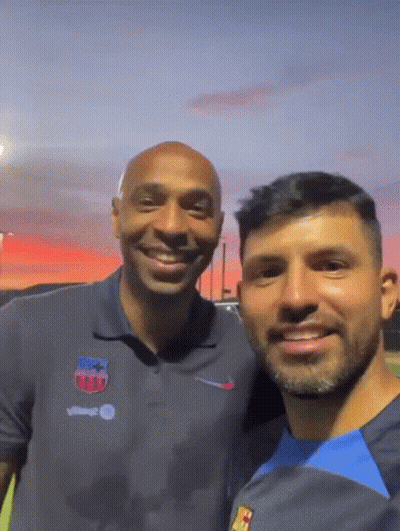 Two Men Posing One With Nike Logo GIF