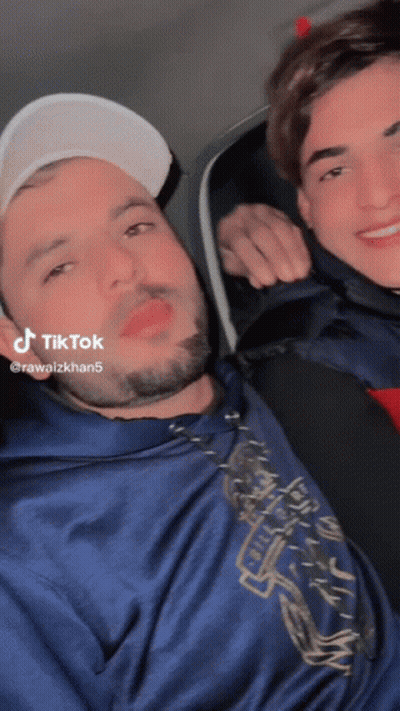 Two Men Posing One With TikTok Sticker GIF