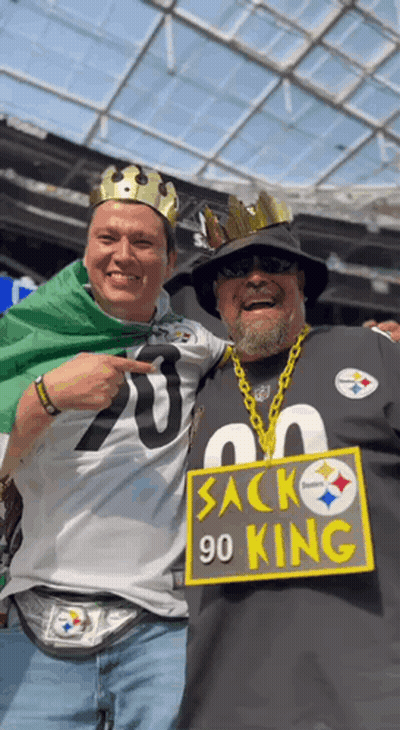 Two Men Posing With 90 King Sign GIF