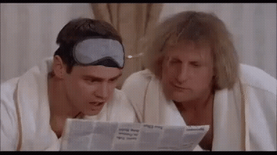 Two Men Reading Newspaper Wearing Sleep Masks GIF