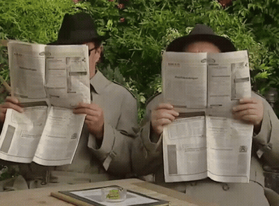 Two Men Reading Newspapers GIF