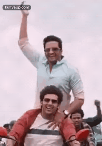 Two Men Riding Motorcycle One Carrying Other GIF