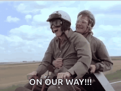 Two Men Riding Motorcycle Saying On Our Way GIF