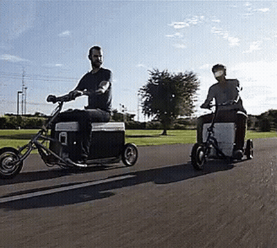 Two Men Riding Motorcycles With Coolers Attached GIF