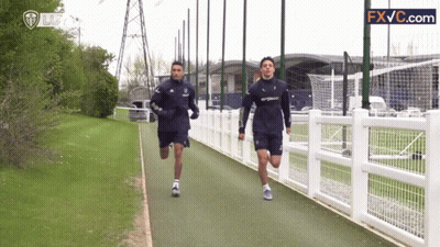 Two Men Running On Path GIF