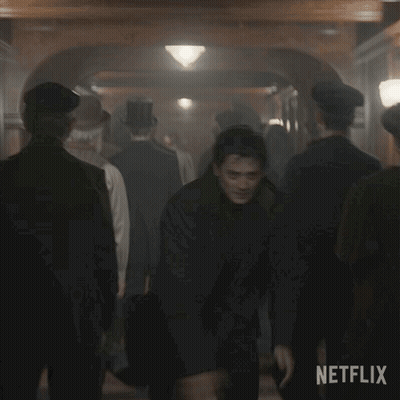 Two Men Shaking Hands In Crowd Netflix GIF