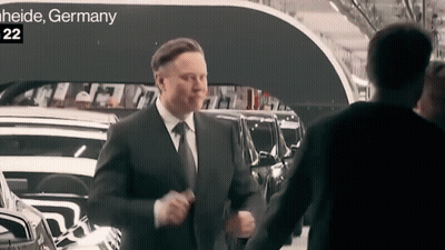 Two Men Shaking Hands In Front Of Heide Germany Sign GIF
