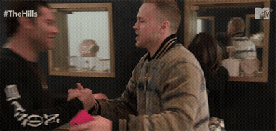 Two Men Shaking Hands In Front Of Mirror GIF