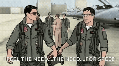 Two Men Shaking Hands In Front Of Planes GIF