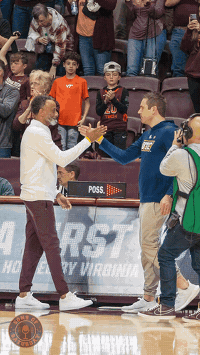 Two Men Shaking Hands In Front Of Poss Sign GIF